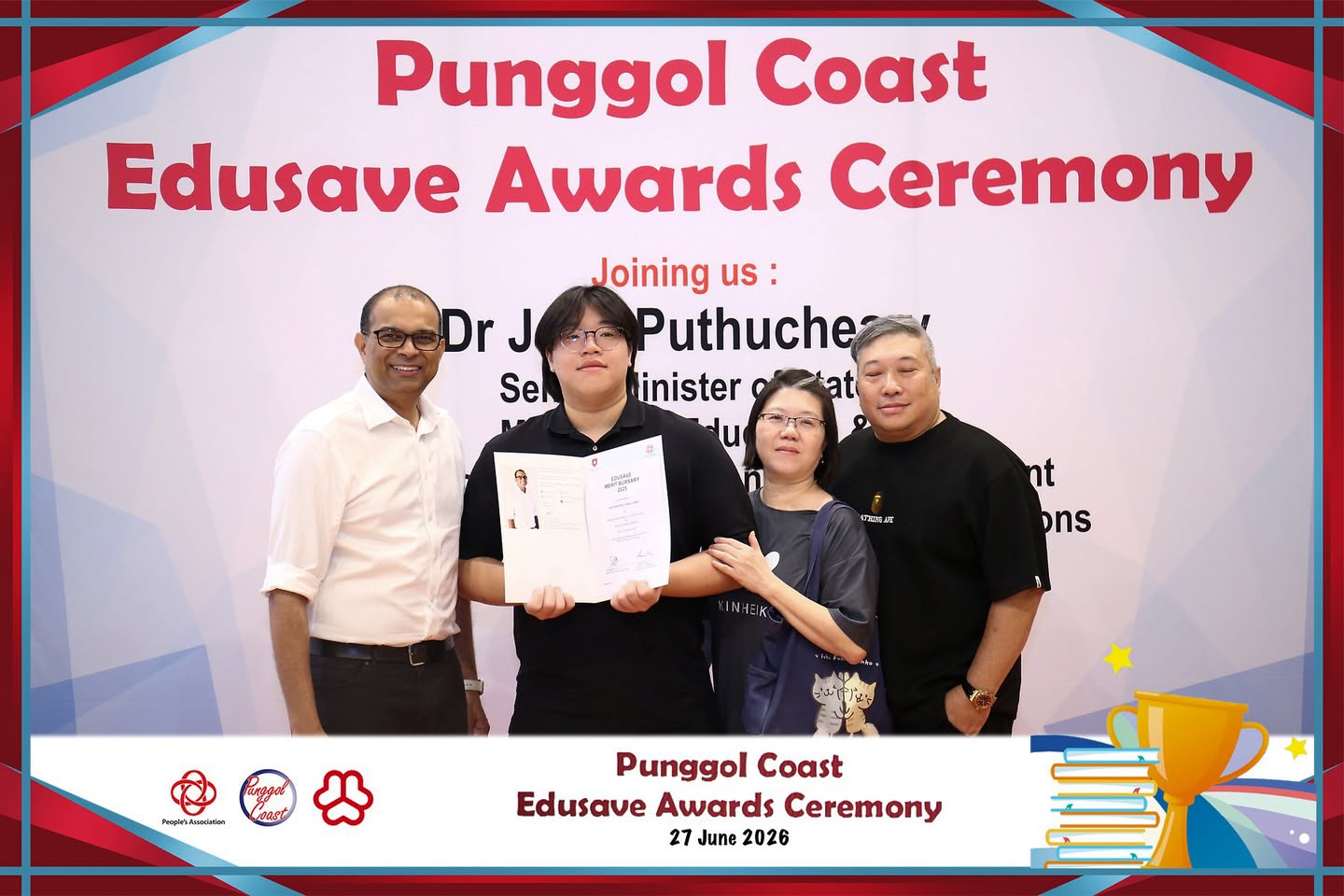 Students holding certificates of achievement