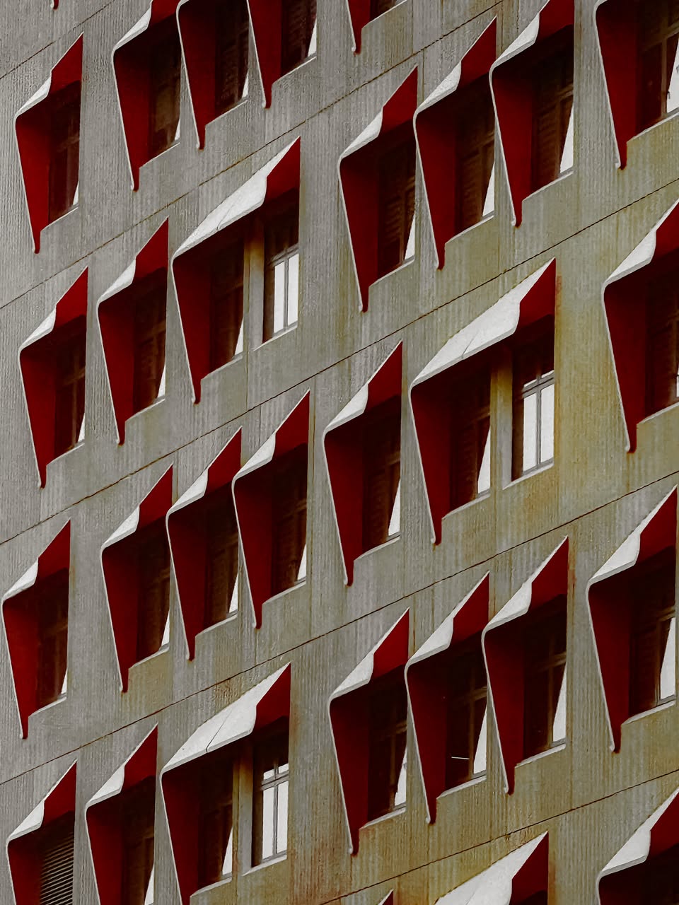 Building facade with geometric window recesses in Punggol