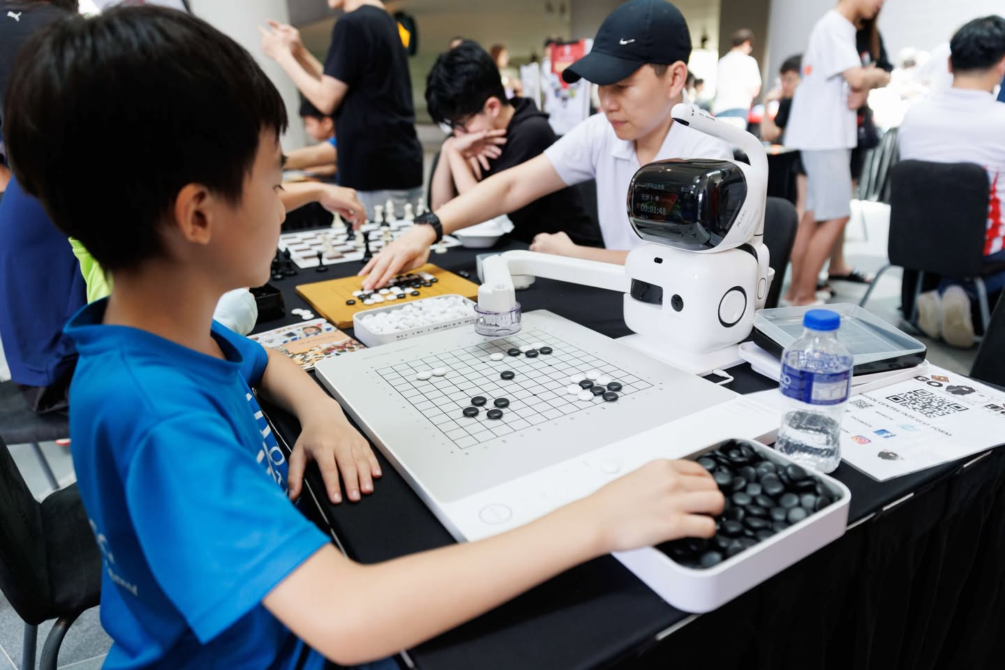 People playing chess and other board games