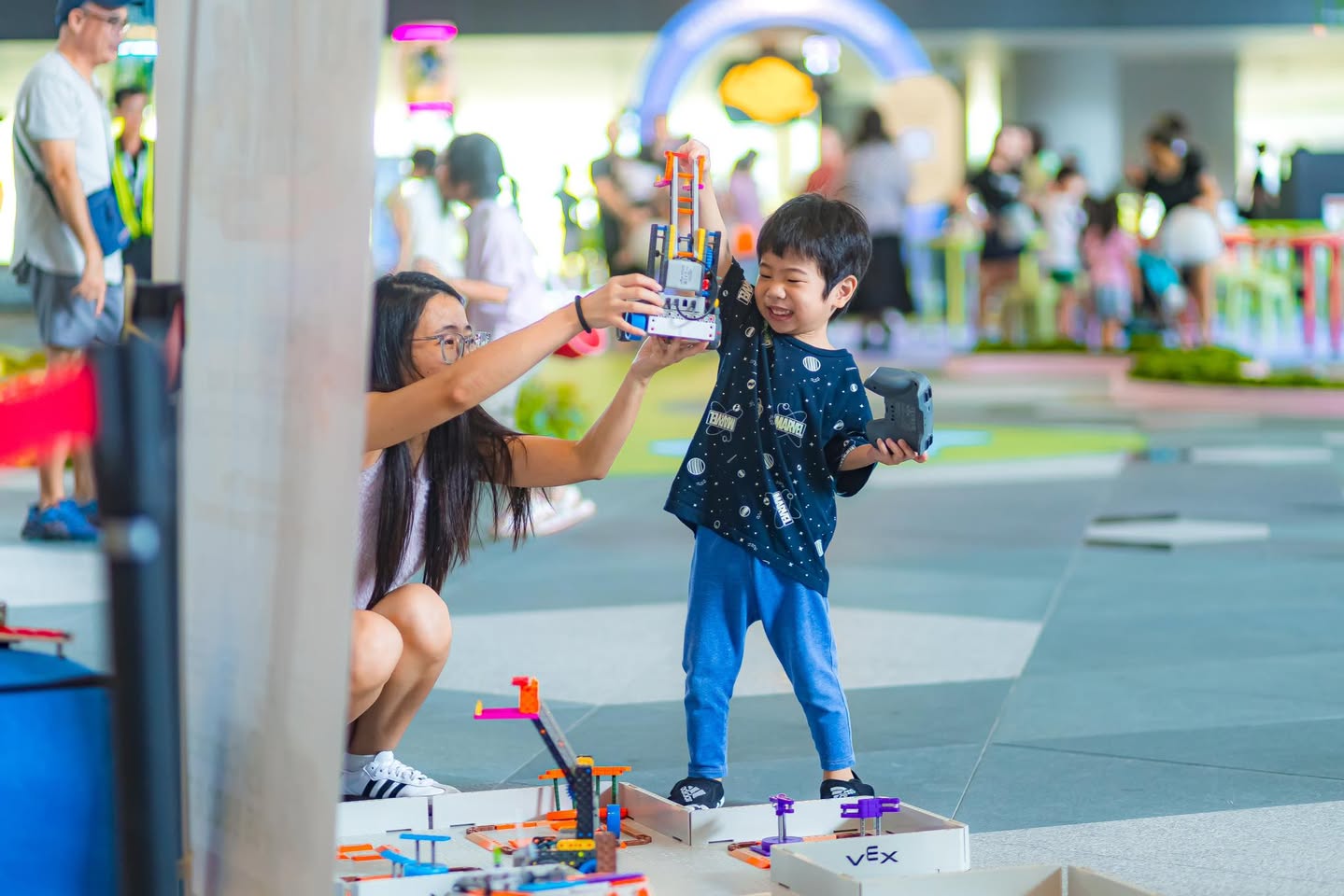 Attendees enjoying the unique exhibits at WonderLab's debut.