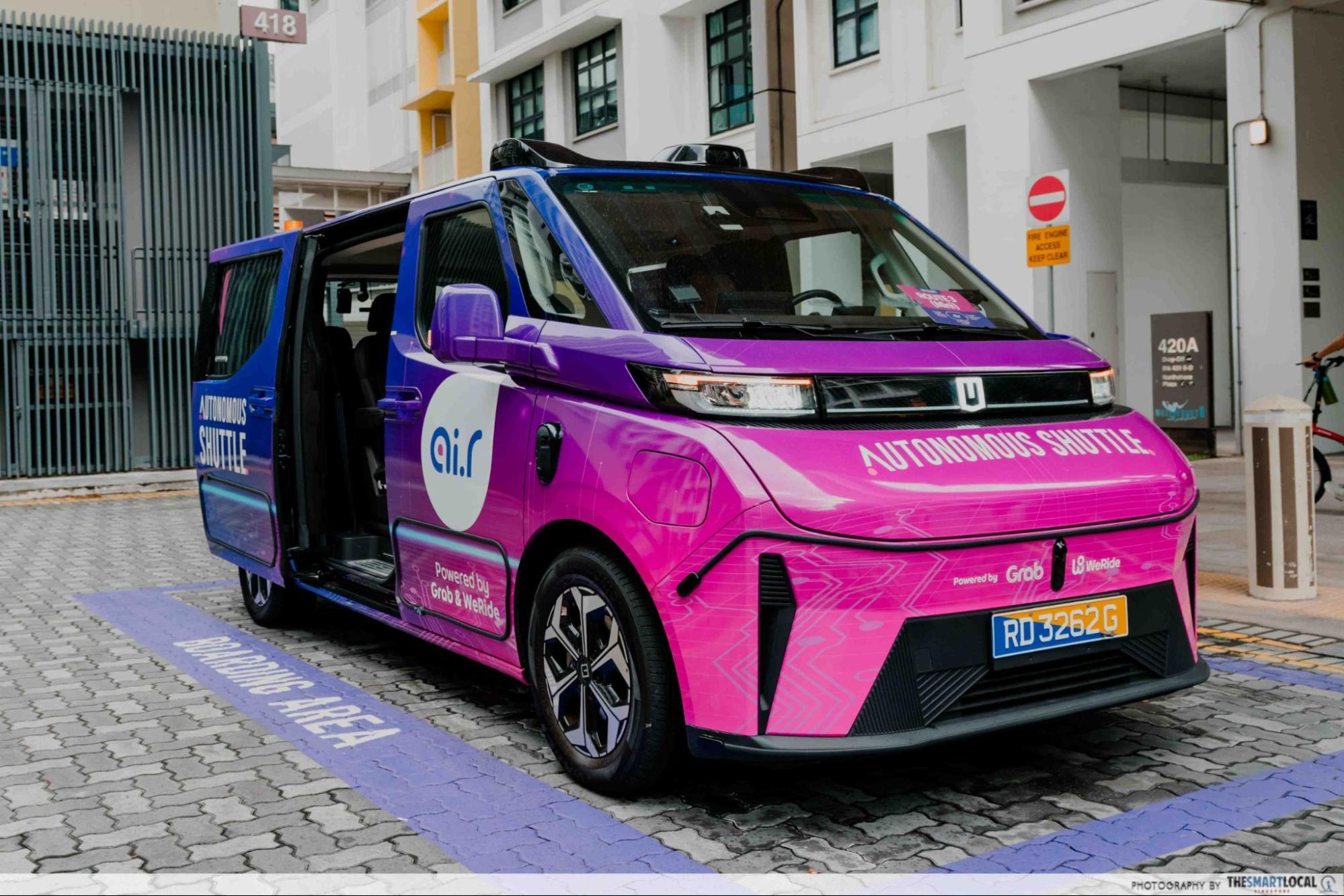 WeRide GXR autonomous shuttle interior with safety operator on board during a Punggol public ride