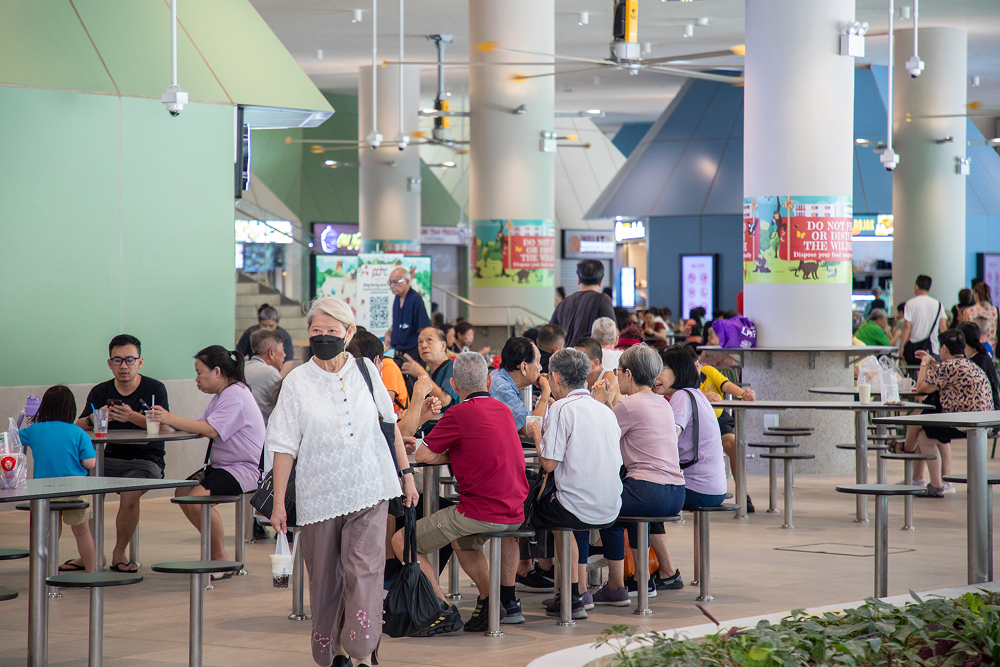 Dining hall of Punggol Coast Hawker Centre at 84 Punggol Way during a busy service
