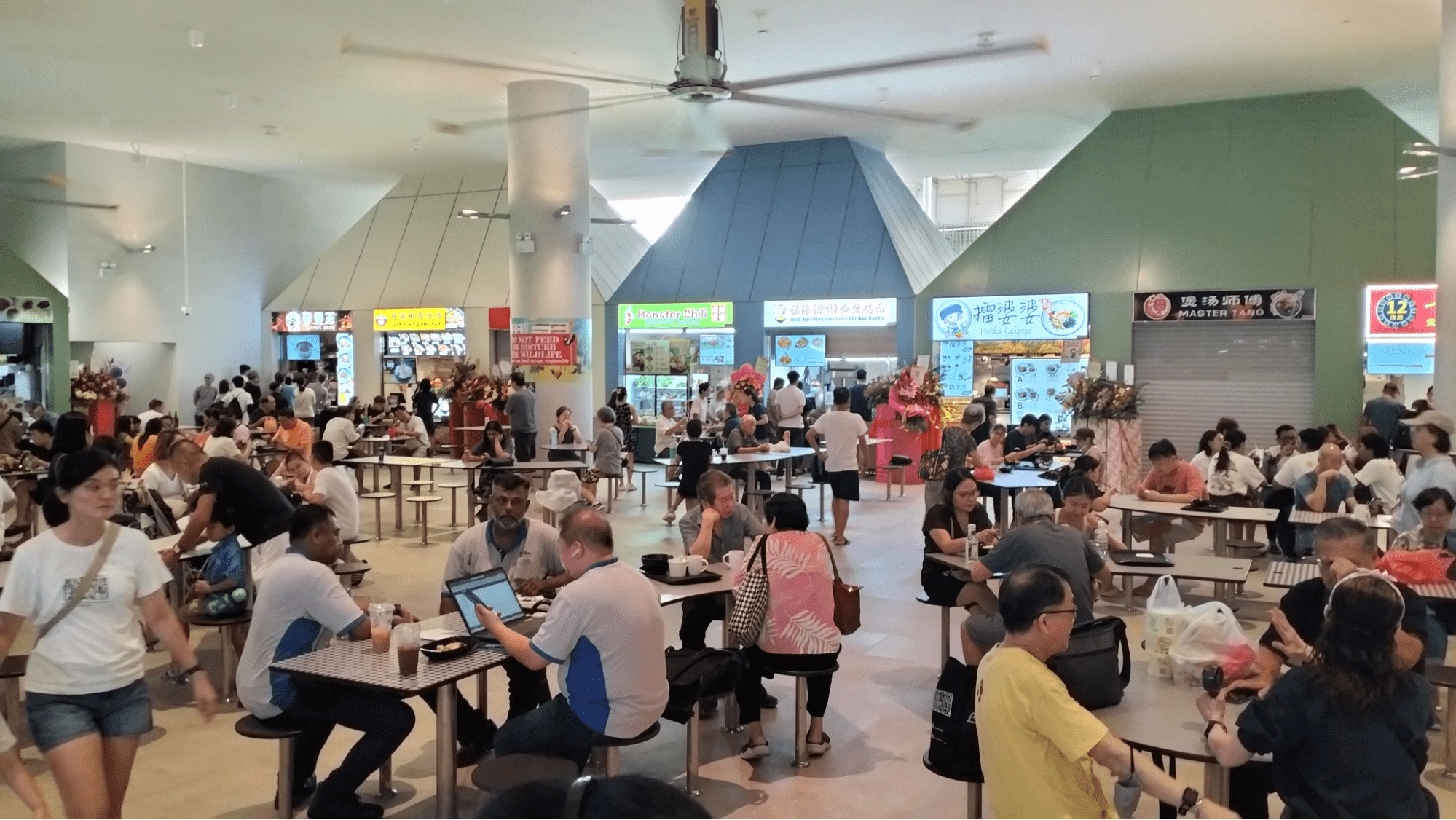 Opening-day crowd at Punggol Coast Hawker Centre with Monster Chili and neighbouring stalls in service