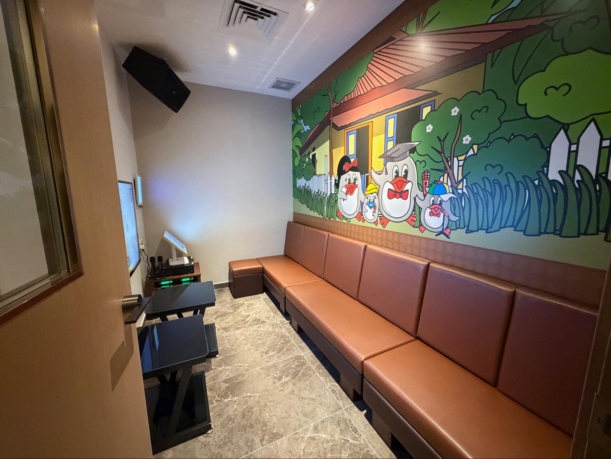 Teo Heng karaoke room with cartoon mural at Punggol Coast Mall