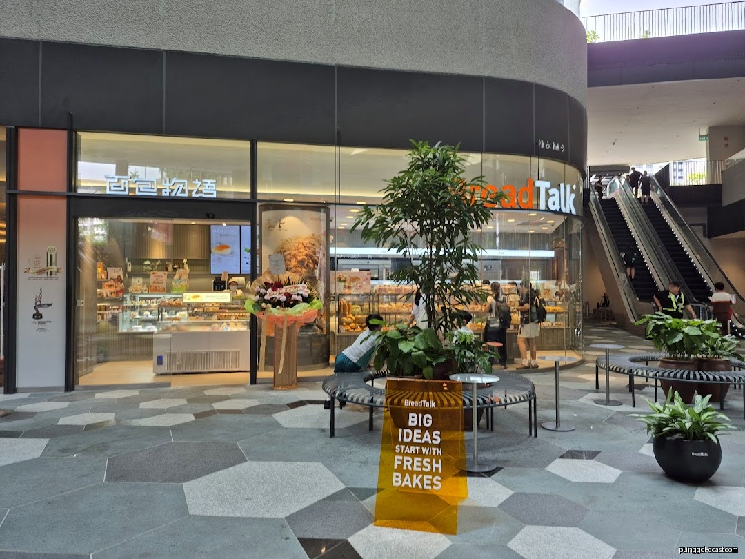 Exterior view of BreadTalk bakery shop with display windows and entrance.