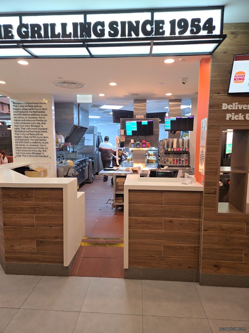 Interior view of a Burger King restaurant showing the counter and kitchen area.