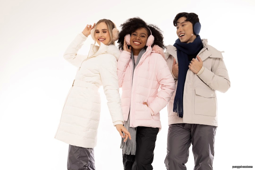 Three models pose in winter jackets and earmuffs against a white background.