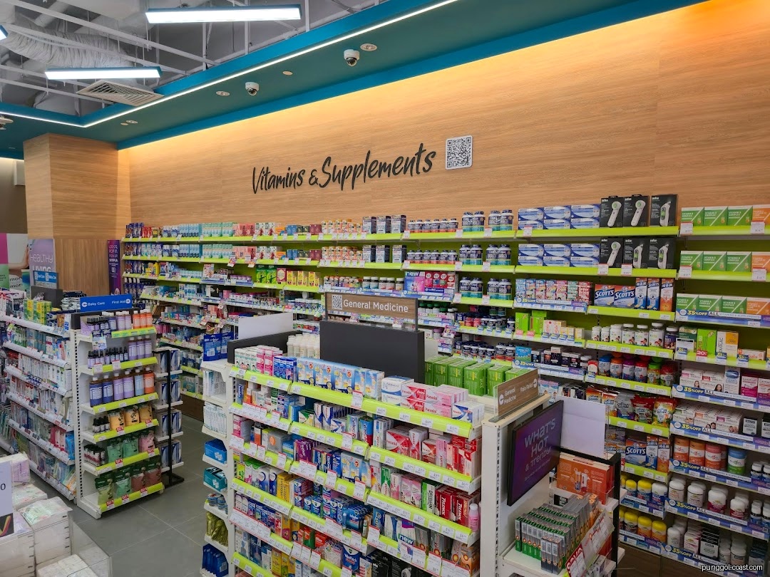 Interior view of a pharmacy with shelves stocked with health products and vitamins.
