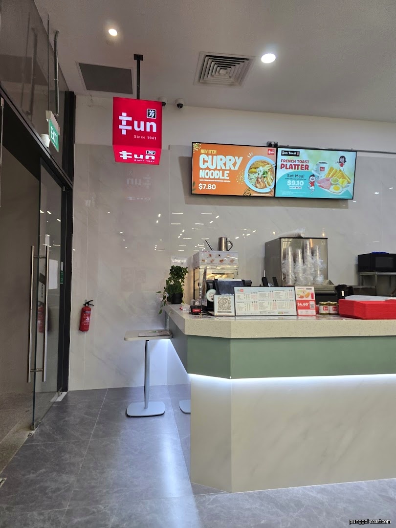 Interior view of Fun Toast shop with counter, hanging sign, and digital menu screens.