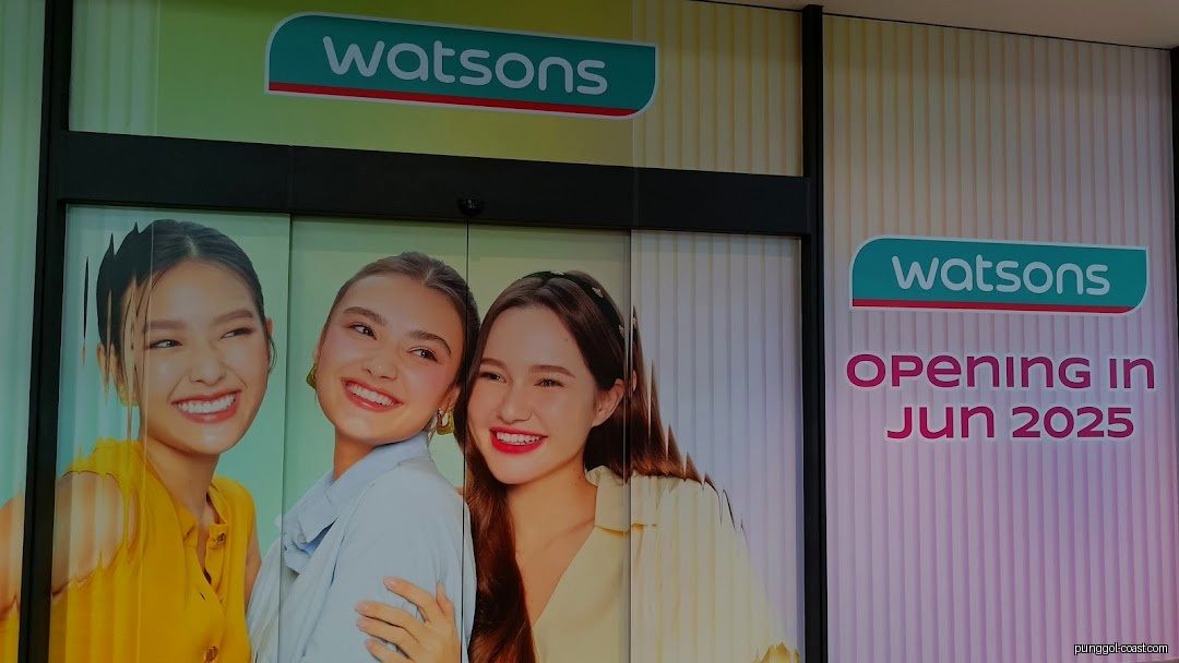 Watsons shop front with opening date and smiling women graphics.