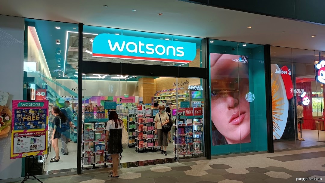 Watsons shop front with customers entering and promotional displays.