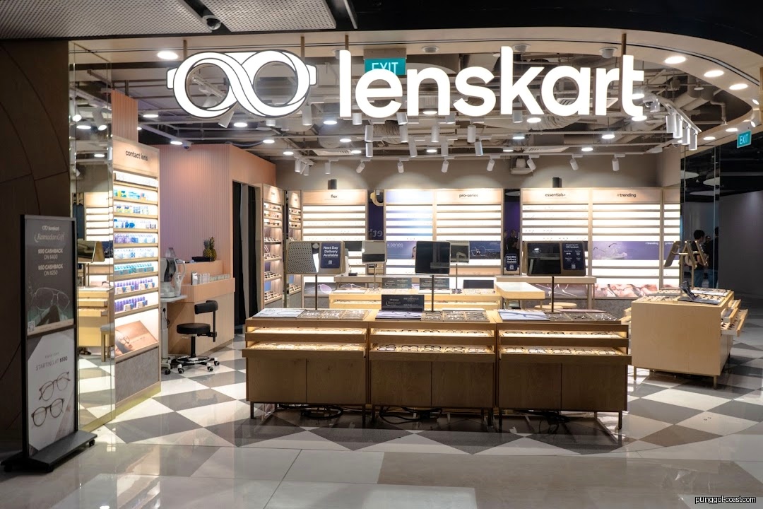 Interior view of Lenskart optical shop with glasses displays and contact lenses.