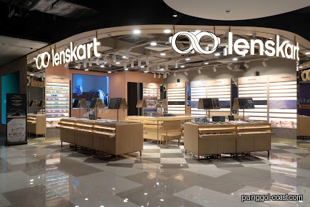 Interior view of Lenskart shop with display cases and glasses.