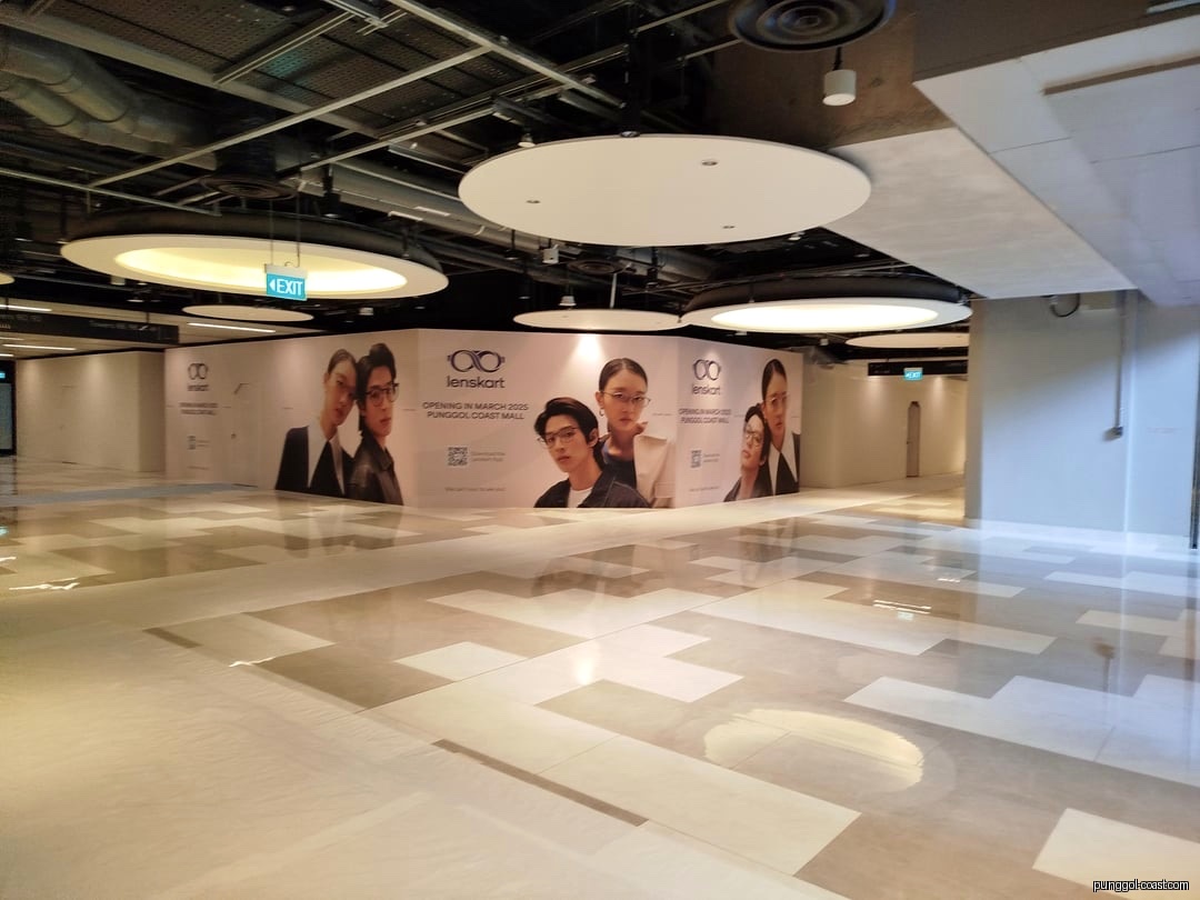 Lenskart shop front hoarding in a mall, announcing March 2025 opening.