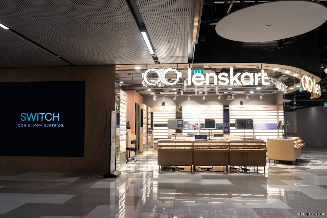 Lenskart shop entrance with interior displays and a large digital screen.