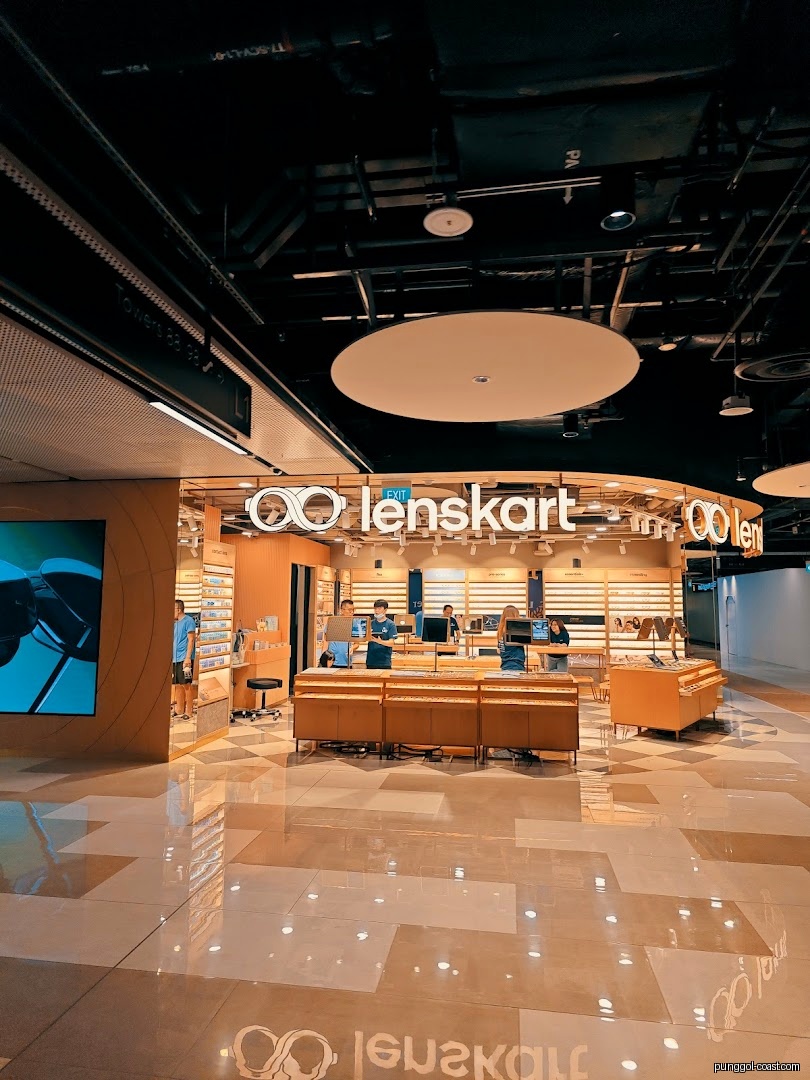 Lenskart shop front in a mall, showing interior and staff.