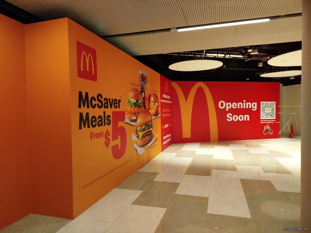 McDonald's 'Opening Soon' hoarding with McSaver Meals promotion.