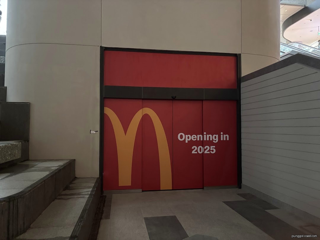 Red McDonald's shop front with "Opening in 2025" text.