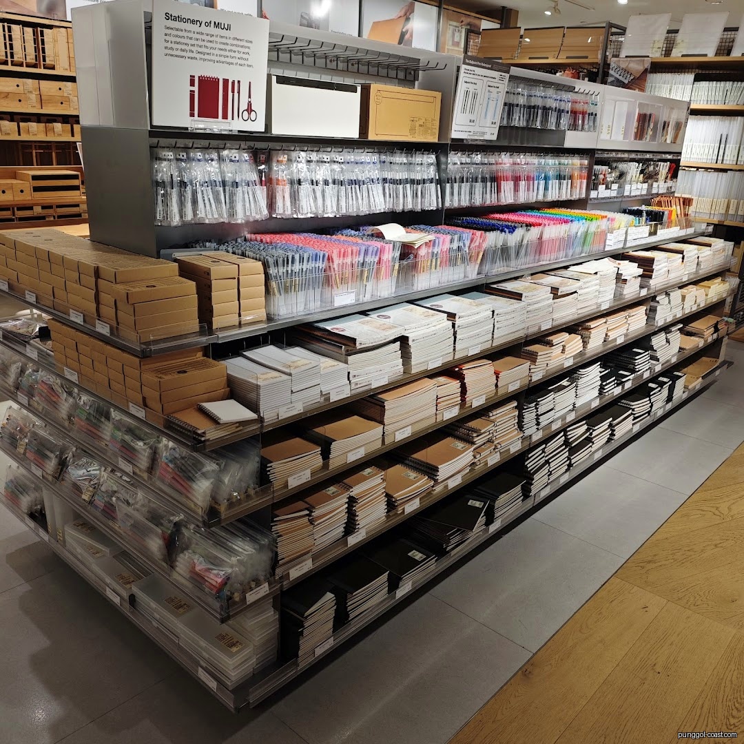 Shelves filled with various stationery items like pens and notebooks.