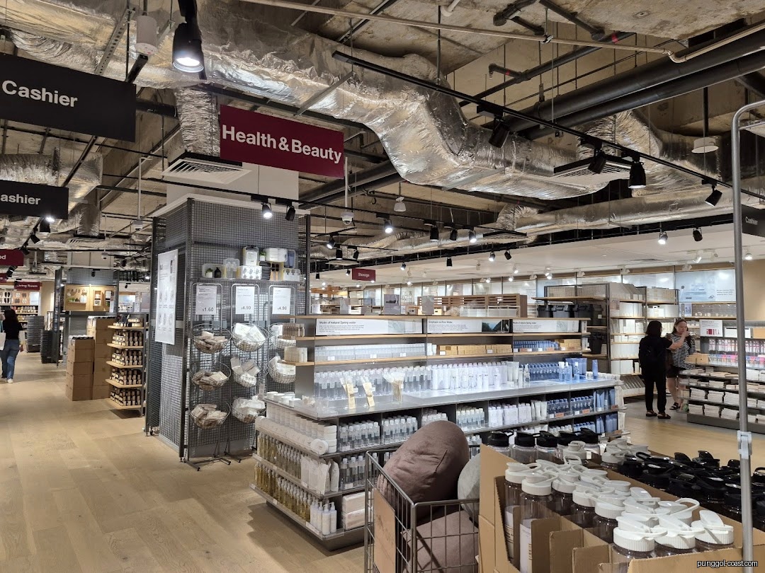 Interior view of a retail store with products on shelves and customers.