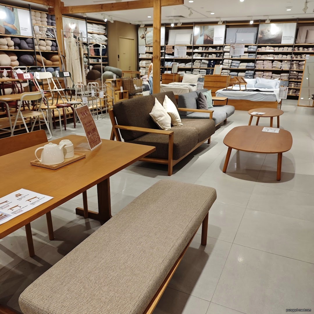 Interior view of a retail store displaying furniture, bedding, and home goods.