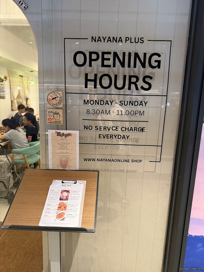 Shop entrance with opening hours sign and an external menu display.