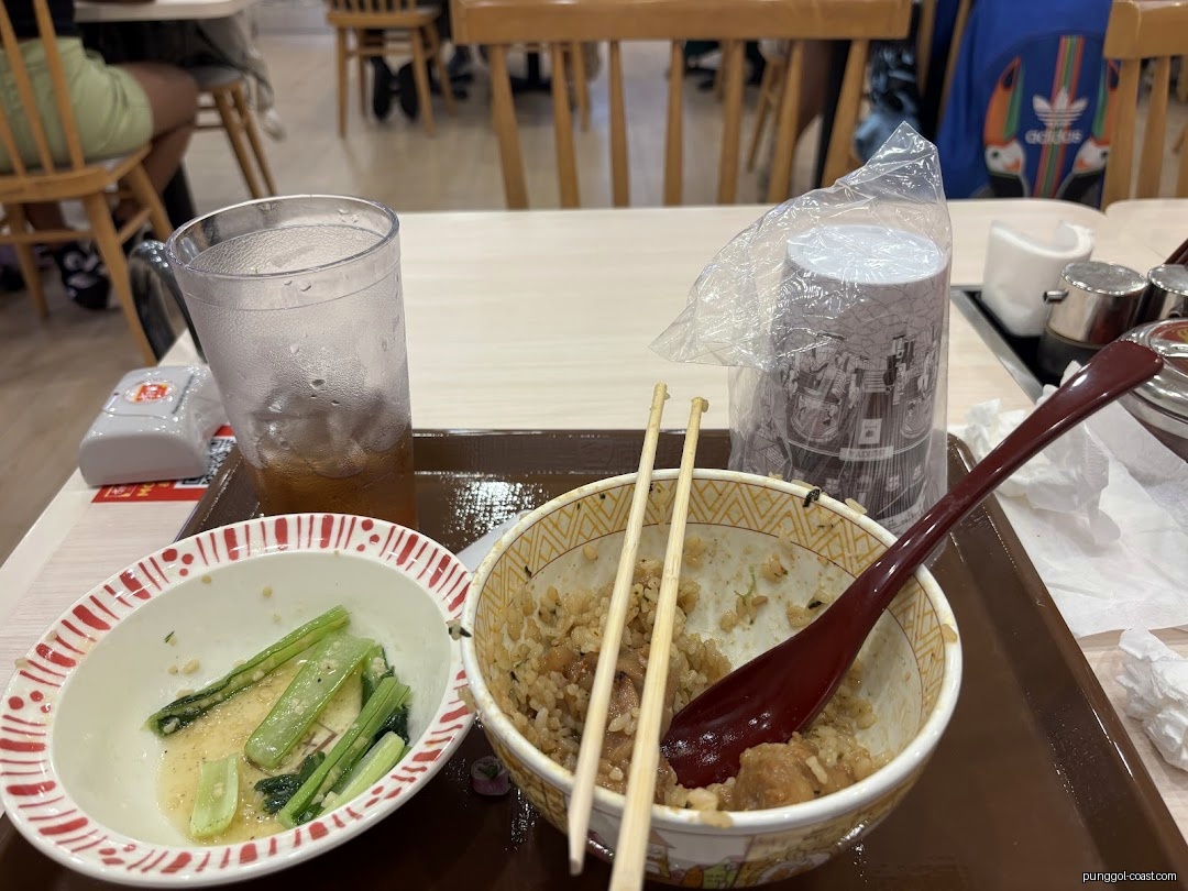 Partially eaten meal on a table in a restaurant dining area.