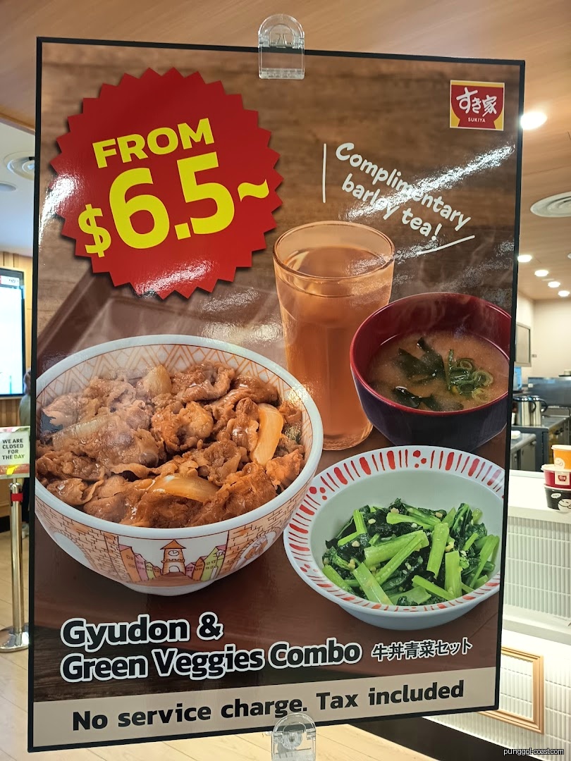 Sukiya promotional menu board displaying Gyudon combo, price, and complimentary tea.