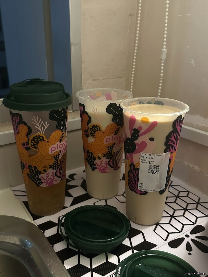 Three drinks from Playground by PlayMade on a patterned mat.