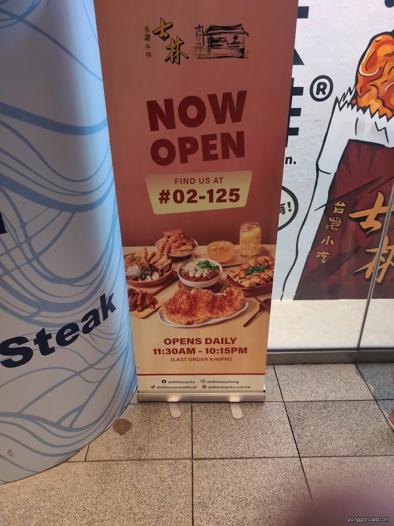 Promotional standee for Shihlin Taiwan Street Snacks showing food, location, and hours.