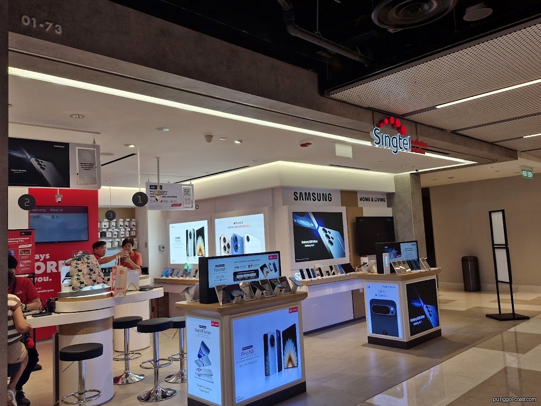 Singtel store interior with various smartphone displays and customers.