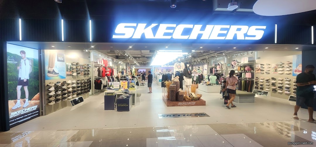 Exterior view of a Skechers store entrance with visible interior and customers.