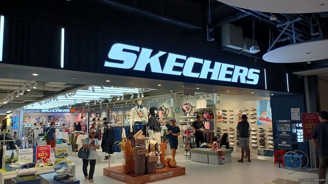 A Skechers retail store entrance with its prominent illuminated sign.