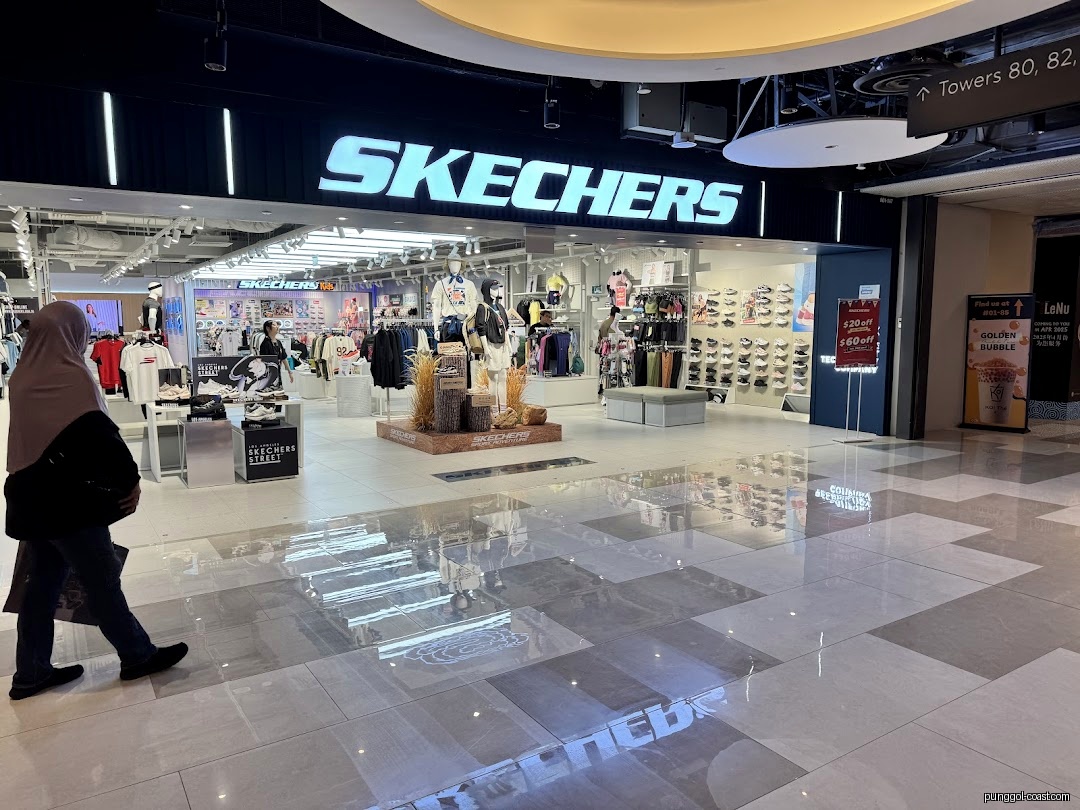 Exterior view of Skechers store entrance with products visible inside.