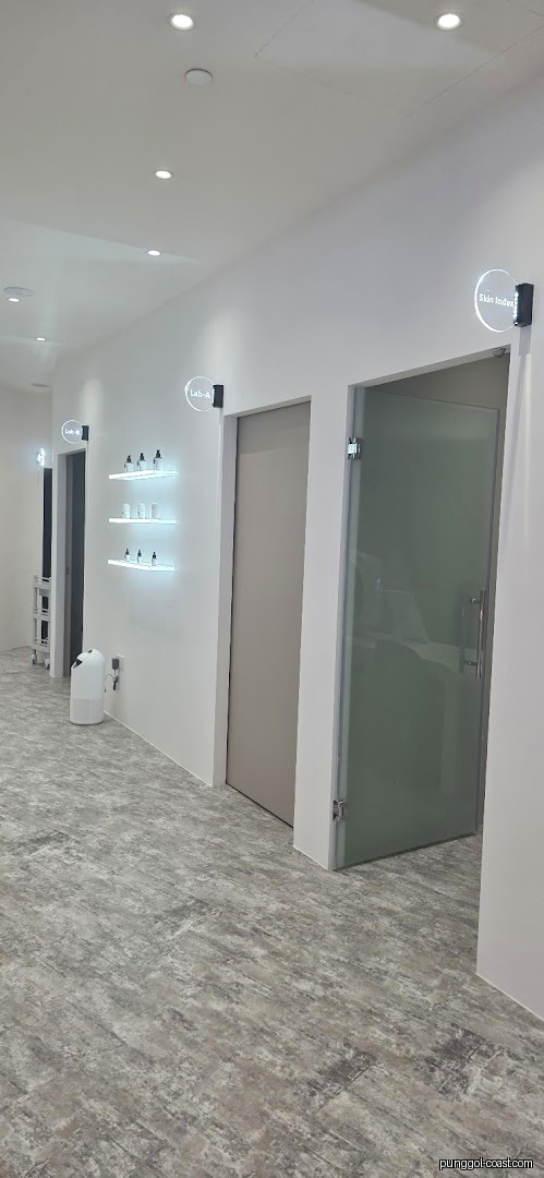 Modern interior hallway with product shelves and multiple room doors.
