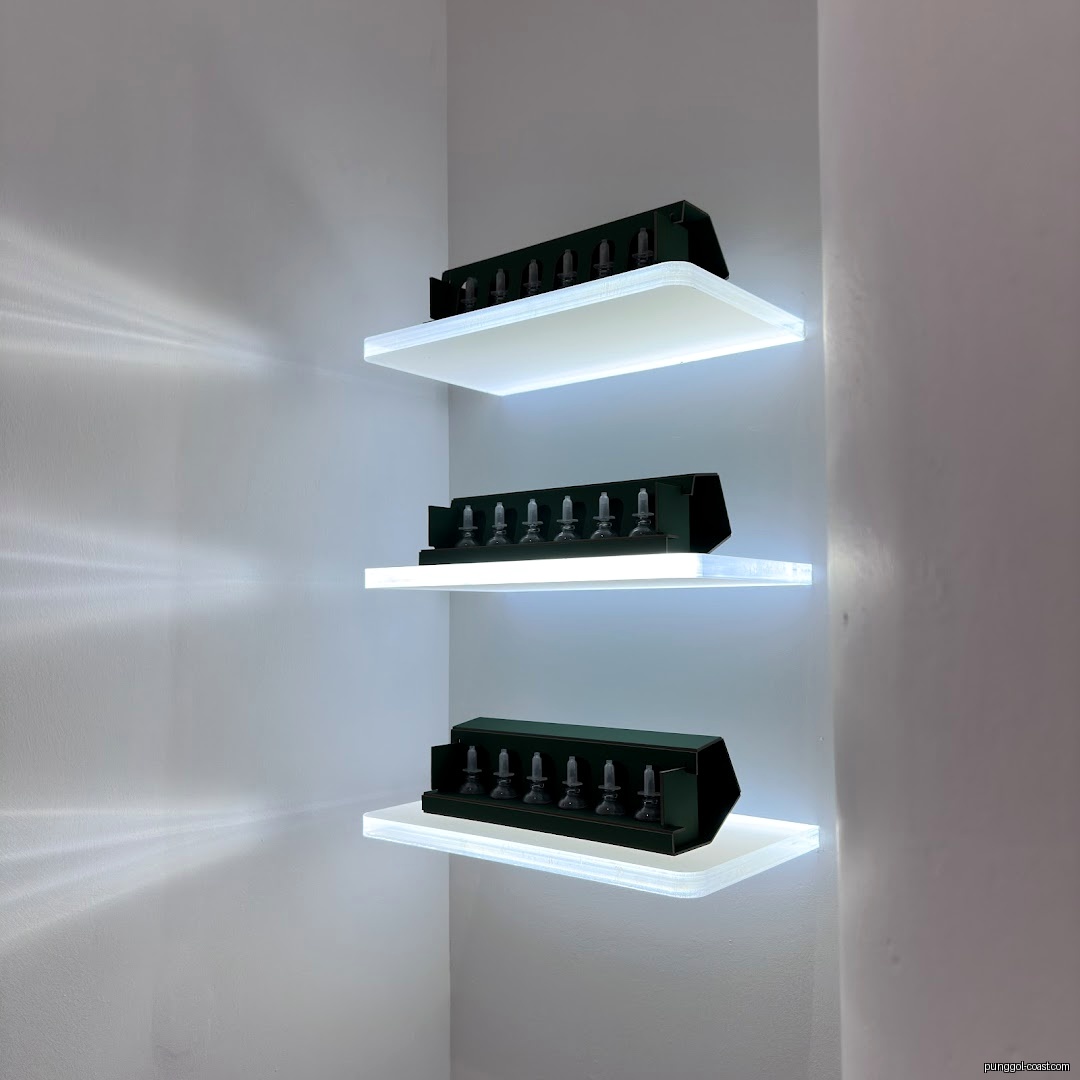 Illuminated shelves displaying skincare products in a shop corner.