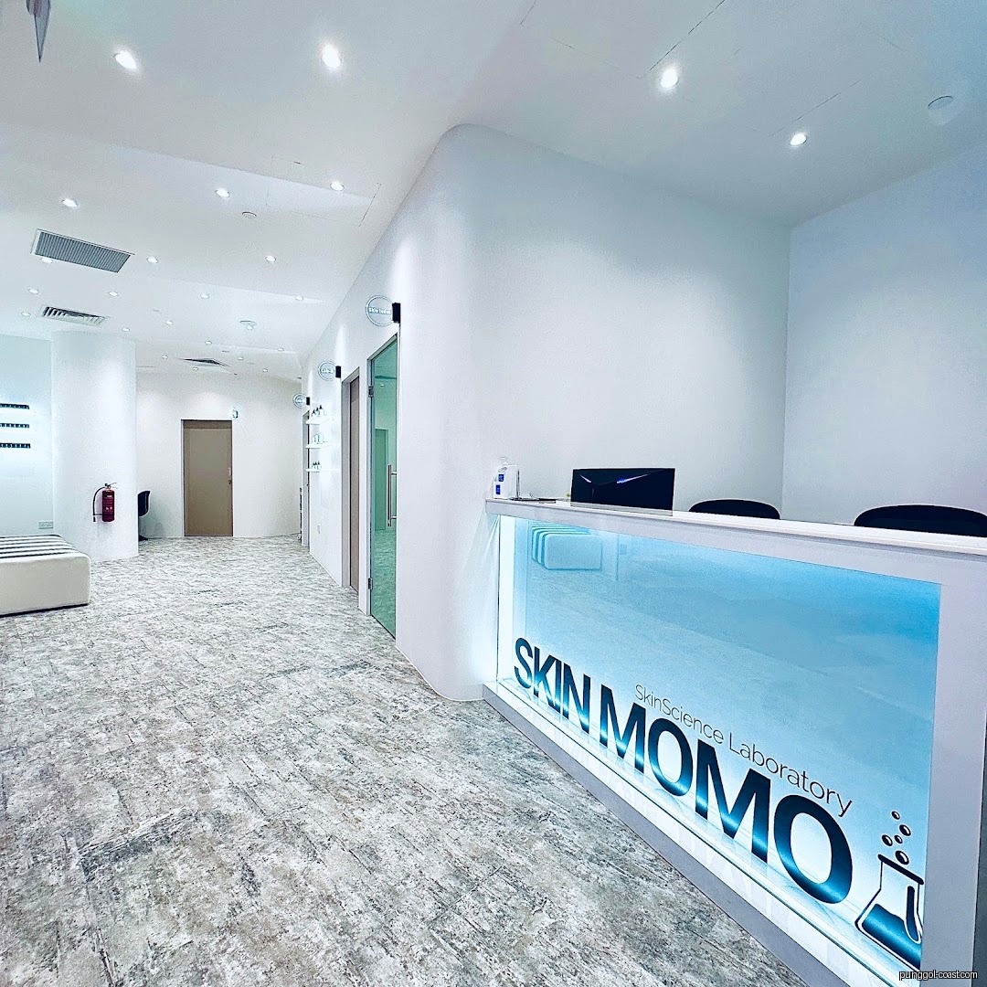 Modern, brightly lit reception area and hallway inside a shop.
