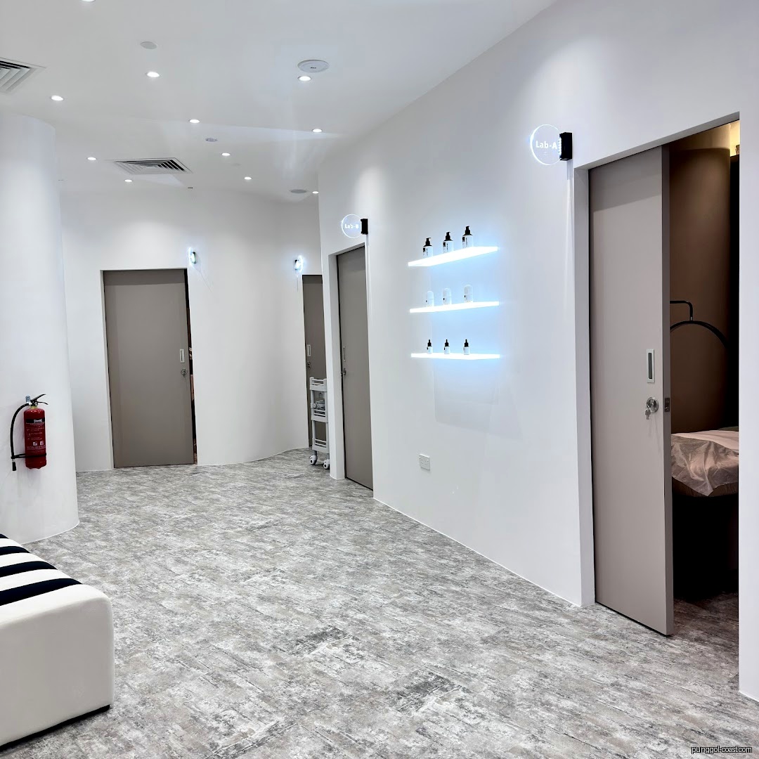 Modern, clean interior hallway with multiple rooms and product display.