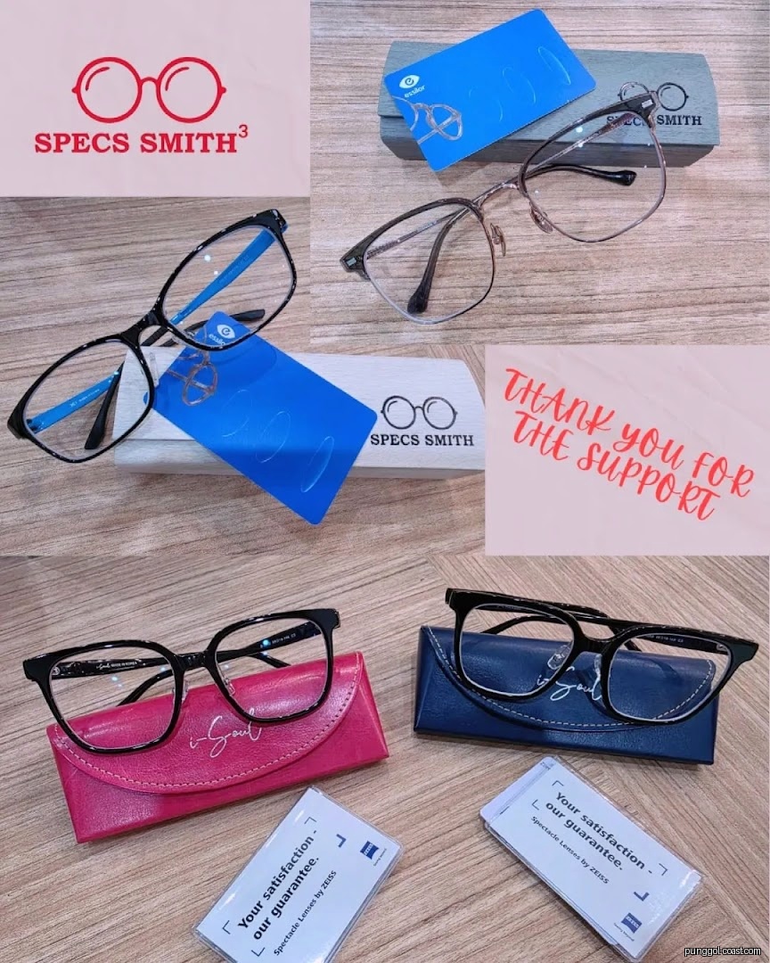 Multiple eyeglasses, cases, and lens guarantee cards displayed.