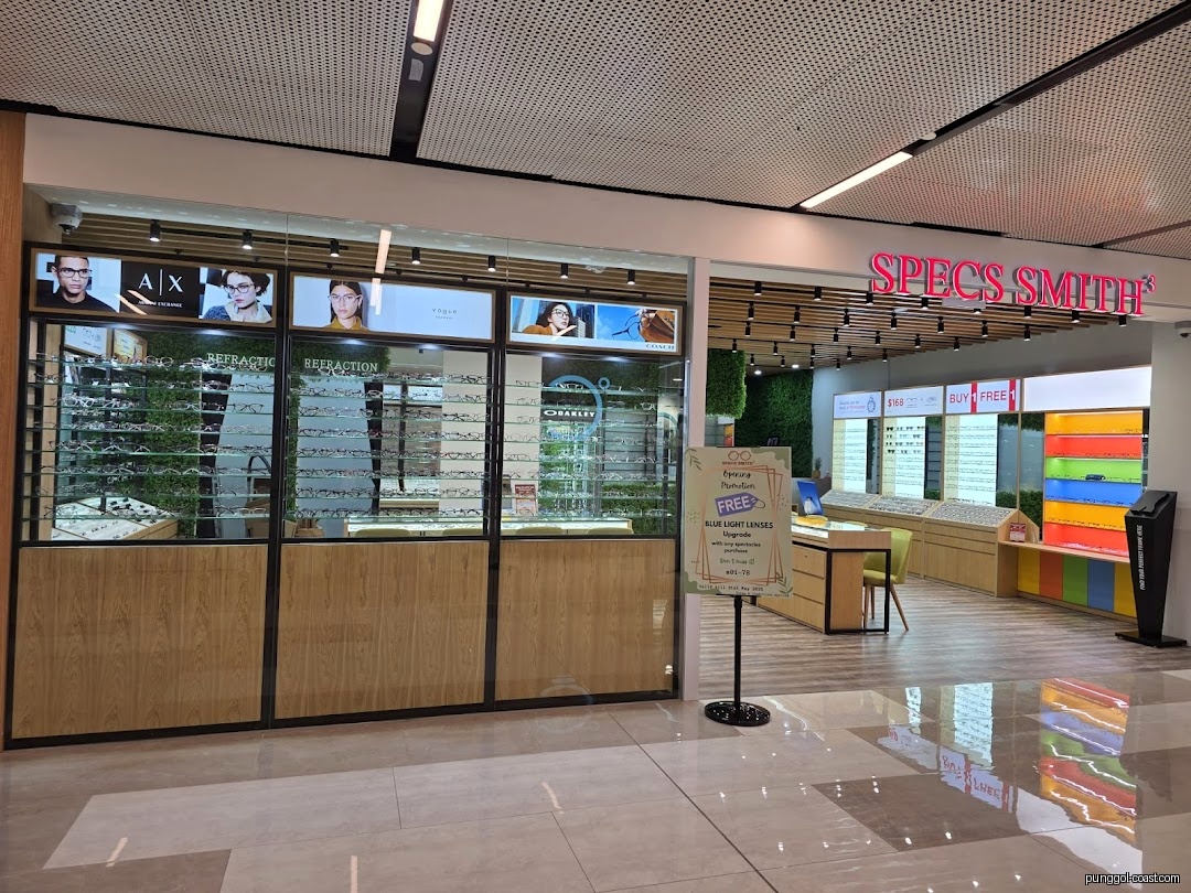 Eyewear shop entrance with displays and prominent signage.