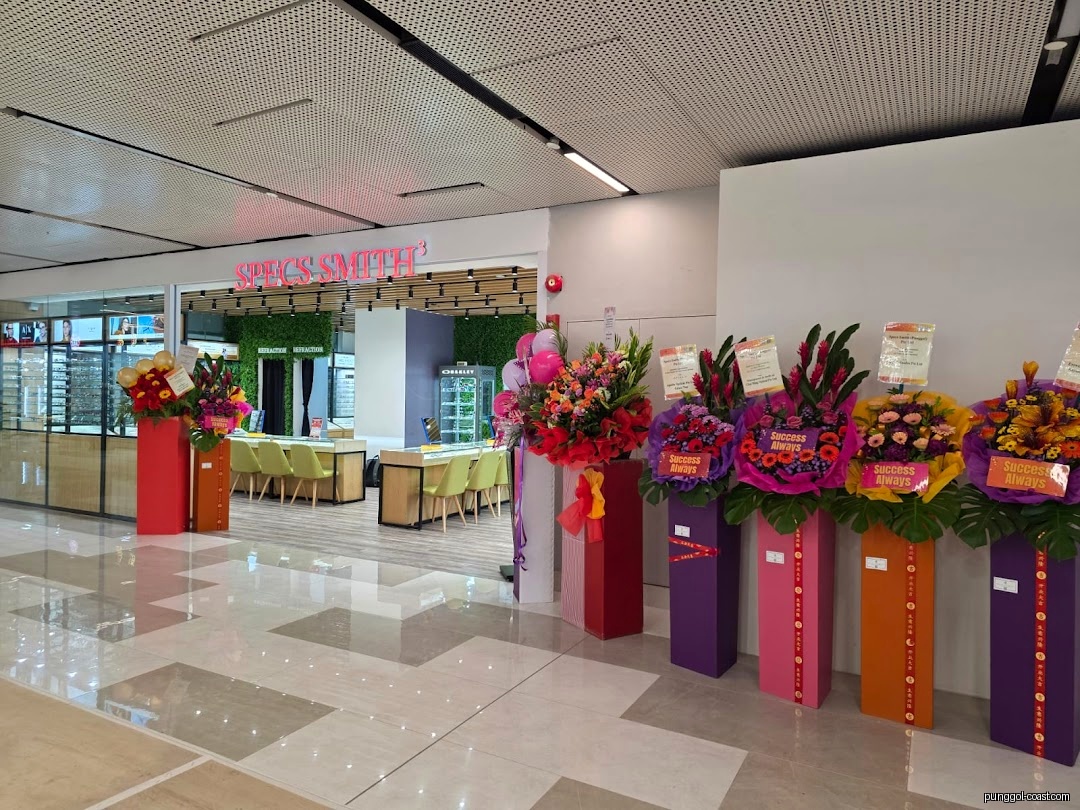 Shop entrance with flower stands and interior visible.