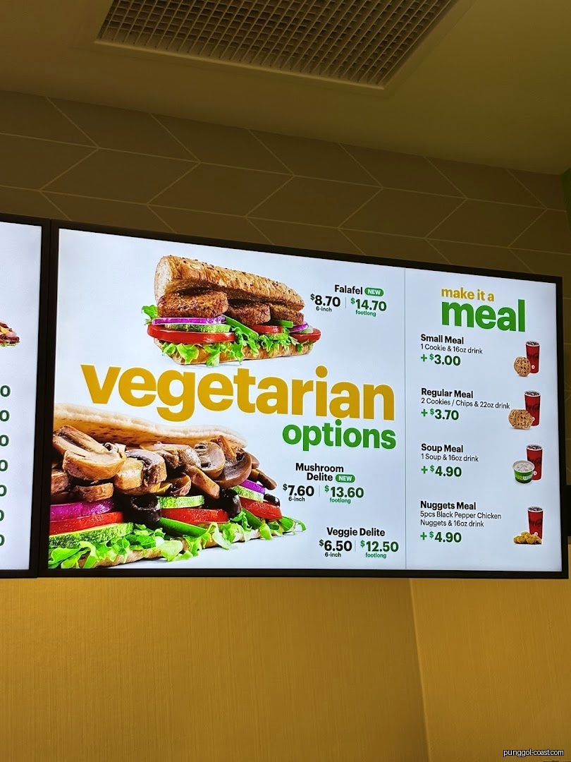 Digital menu board displaying Subway's vegetarian options and meal deals.