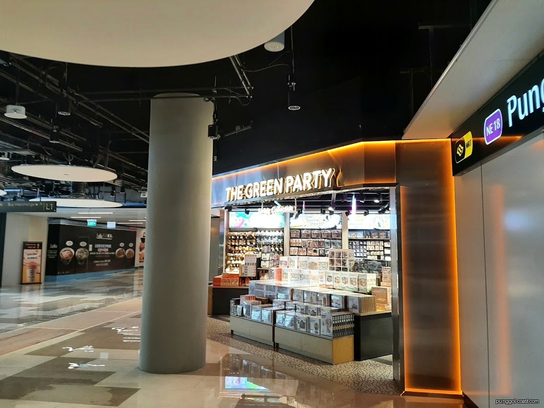 The Green Party shop entrance with products displayed in a mall setting.