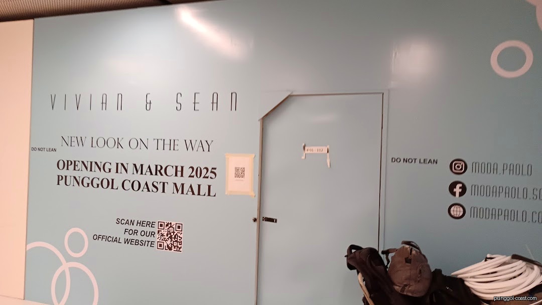 Temporary shop front hoarding for Vivian & Sean, announcing opening in March 2025.