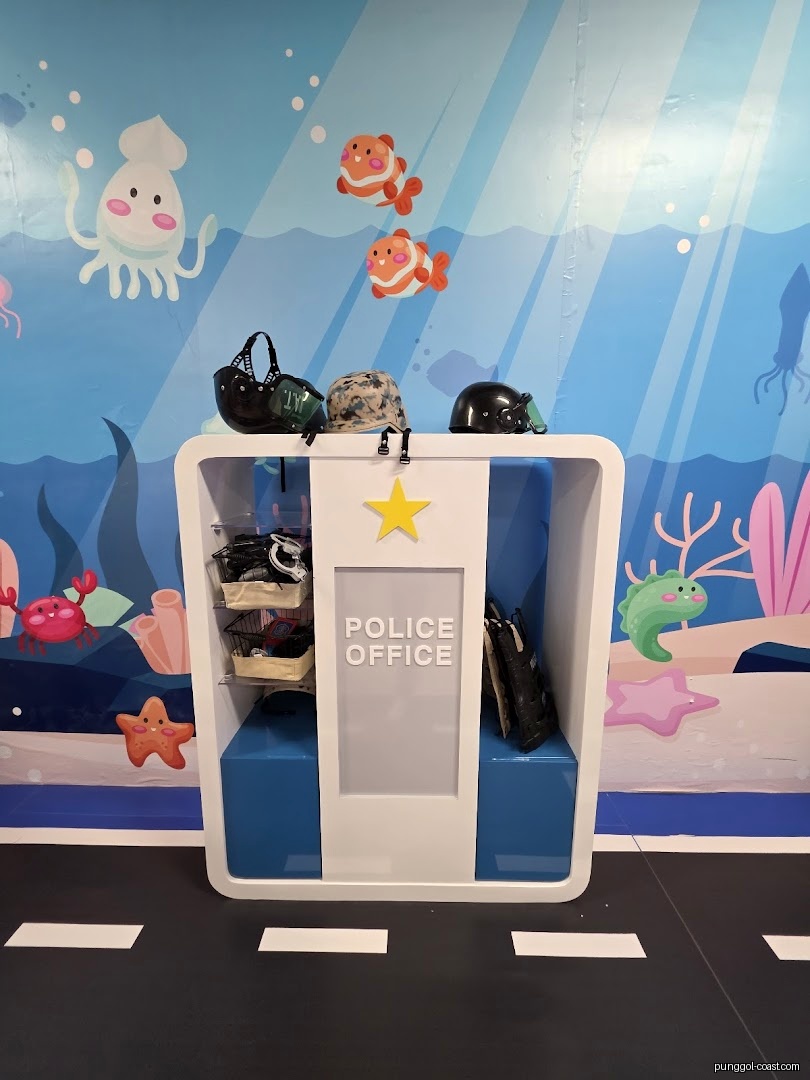 Interior shot of a play police office with ocean mural background.