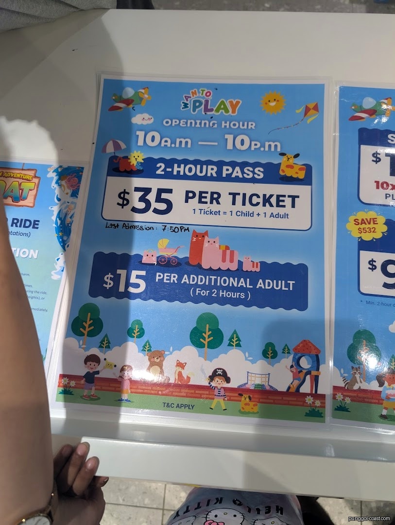 Sign displaying prices and opening hours for Wan To Play.