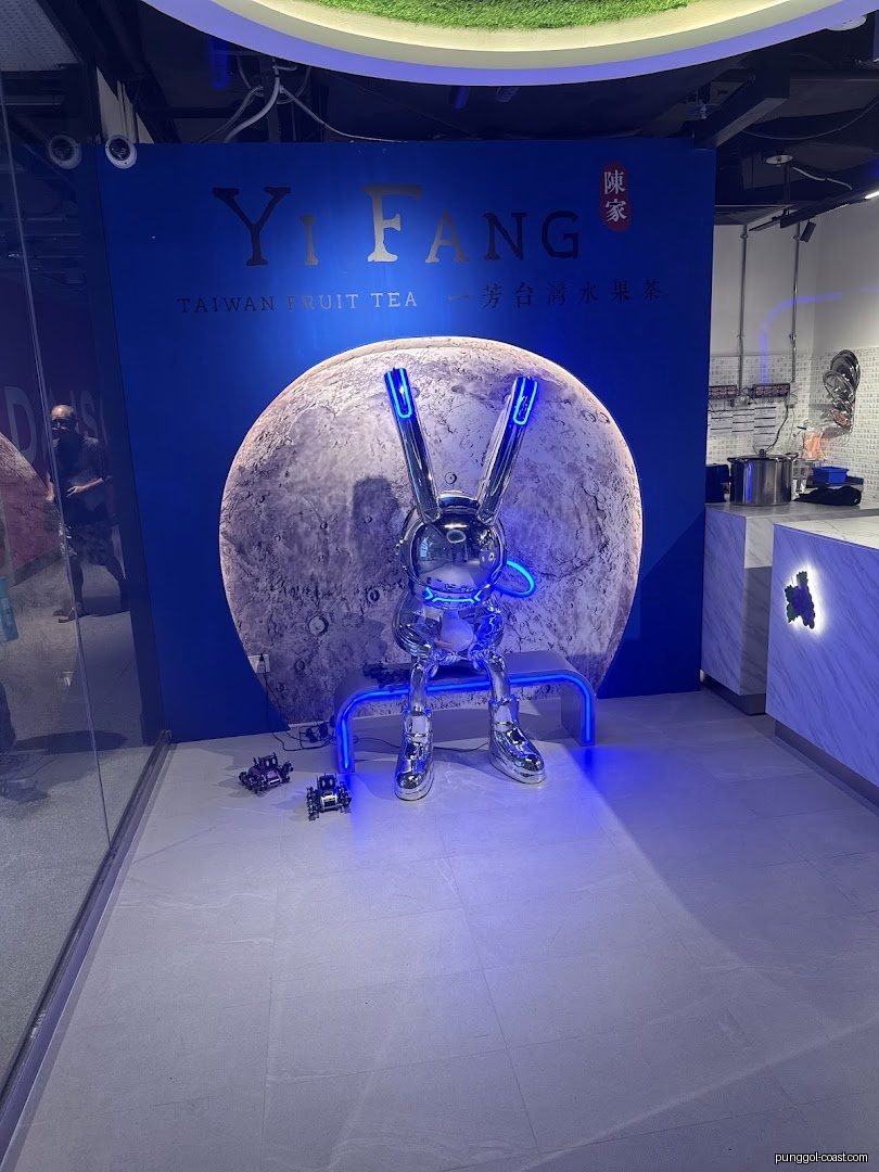 Shop interior featuring Yi Fang branding, a moon, and a metallic rabbit statue.