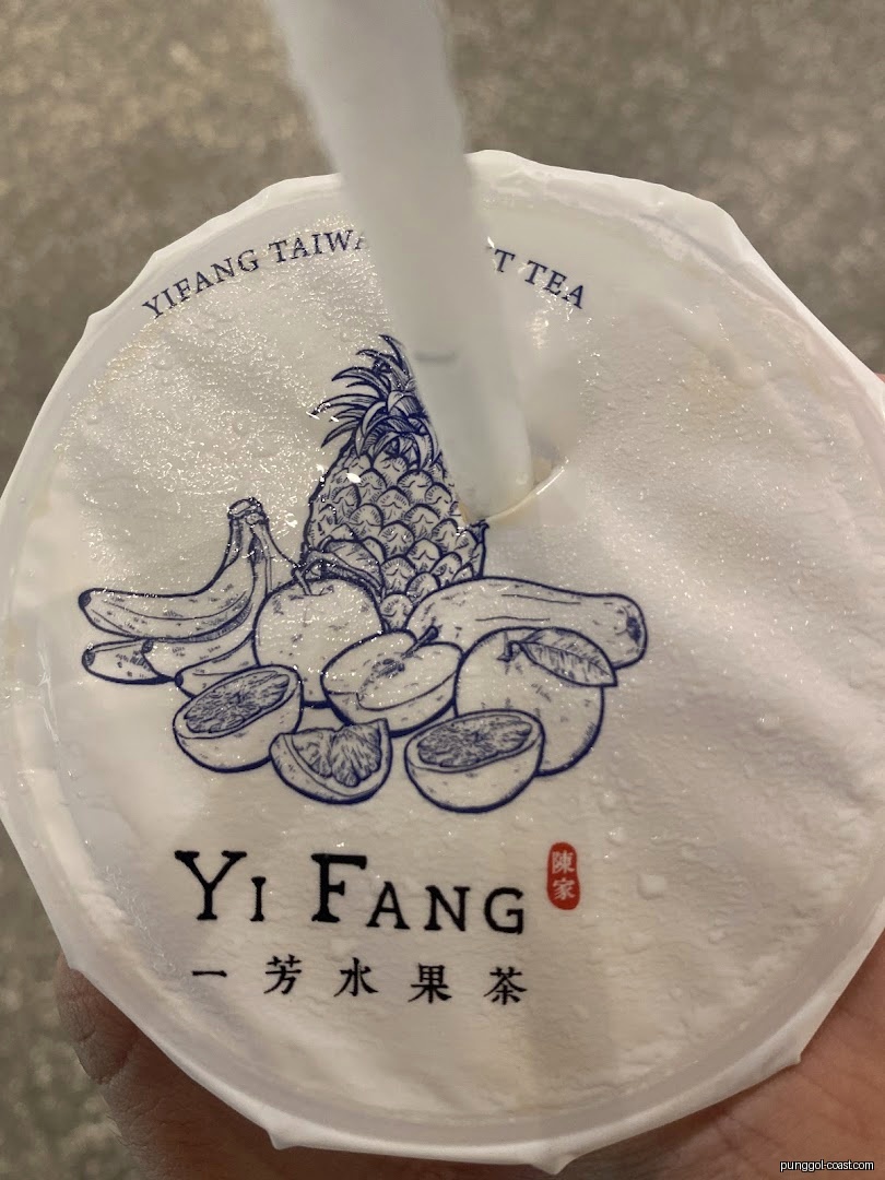 Yi Fang Taiwan Fruit Tea cup lid with fruit illustrations and straw.